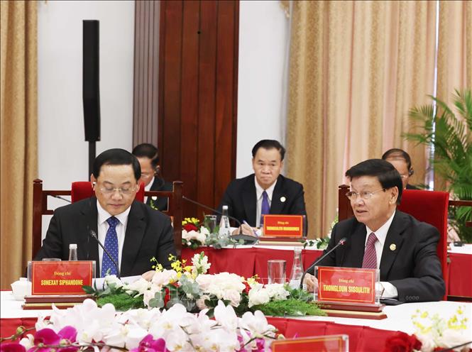 Tổng Bí thư Đảng Nhân dân Cách mạng Lào, Chủ tịch nước Lào Thongloun Sisoulith và Thủ tướng Lào Sonexay Siphandone tại cuộc gặp. Ảnh: Thống Nhất – TTXVN