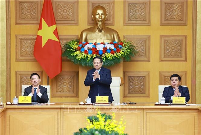 Prime Minister Pham Minh Chinh, along with Deputy Prime Ministers Ho Duc Phoc and Nguyen Chi Dung, at the dialogue. VNA Photo: Dương Giang 