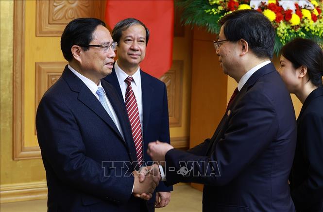 Thủ tướng Phạm Minh Chính tiếp đồng chí Khưu Dũng, Bí thư Đảng uỷ Đại học Thanh Hoa, Trung Quốc. Ảnh: Dương Giang-TTXVN 