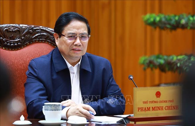 Prime Minister Pham Minh Chinh speaks at the meeting. VNA Photo: Dương Giang