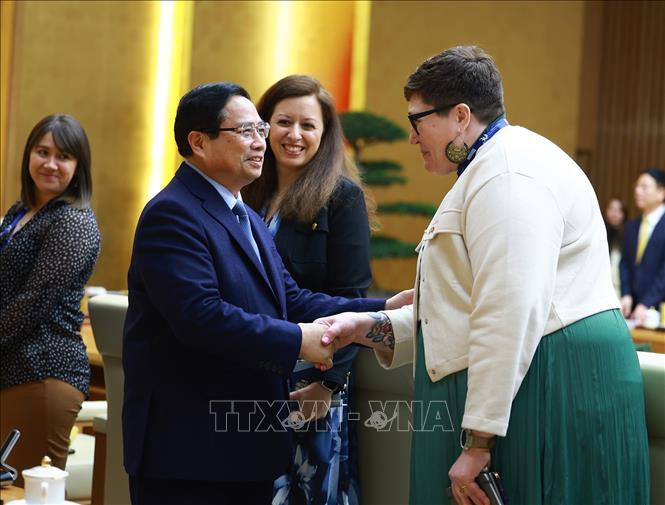 Thủ tướng Phạm Minh Chính với lãnh đạo các trường đại học của Hoa Kỳ sang Việt Nam dự Chương trình Hợp tác Học thuật Quốc tế (IAPP). Ảnh: Dương Giang-TTXVN
