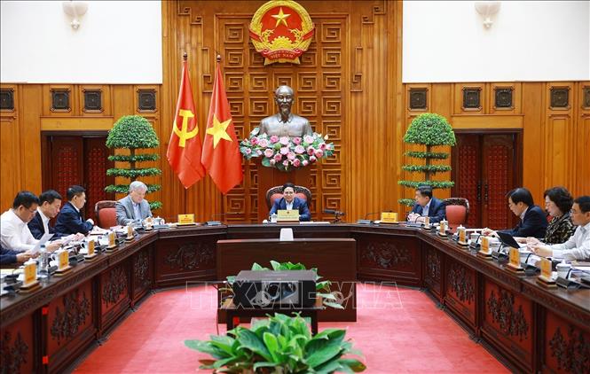 Thủ tướng Phạm Minh Chính chủ trì cuộc họp về mức áp thuế mới của Hoa Kỳ đối với hàng hoá nhập khẩu từ Việt Nam. Ảnh: Dương Giang-TTXVN 
