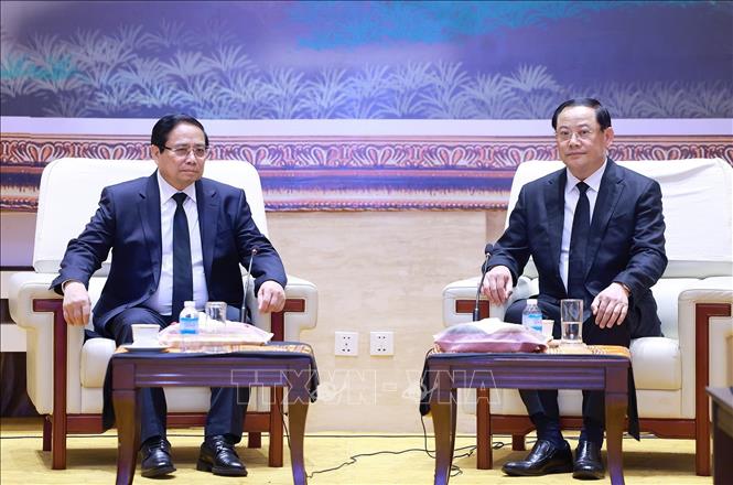 Thủ tướng Phạm Minh Chính gặp Thủ tướng Lào Sonexay Siphandone. Ảnh: Dương Giang-TTXVN
