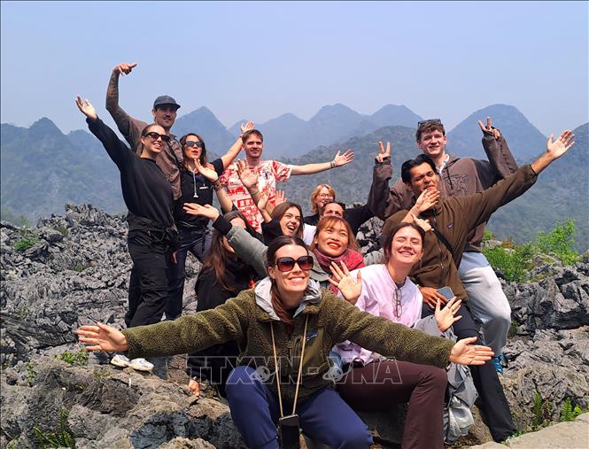 Foreign tourists are excited to visit Ha Giang. VNA Photo: Đức Thọ
