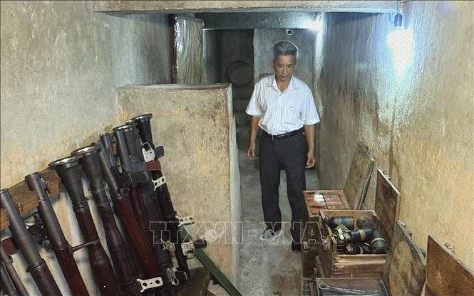Căn hầm từng chứa hơn 2 tấn vũ khí các loại, bao gồm: lựu đạn, thuốc nổ, súng AK, súng B40... Ảnh: Hữu Duyên - TTXVN