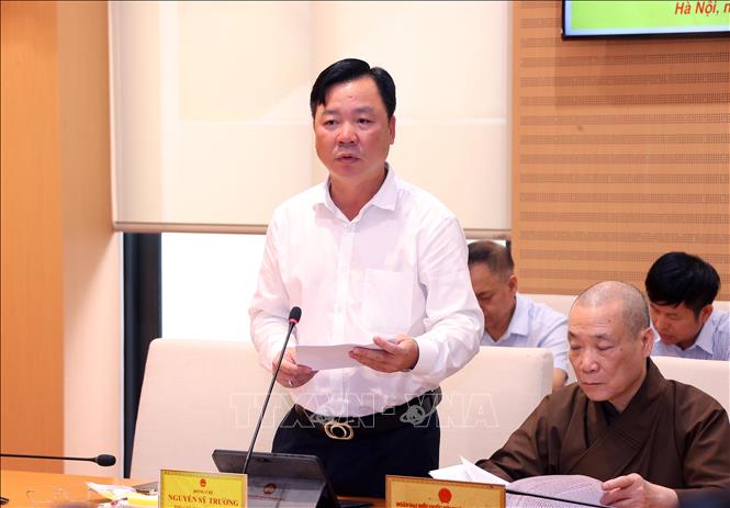 Phó Chủ tịch Thường trực Ủy ban MTTQ Việt Nam thành phố Hà Nội Nguyễn Sỹ Trường báo cáo tại buổi làm việc. Ảnh: Văn Điệp – TTXVN