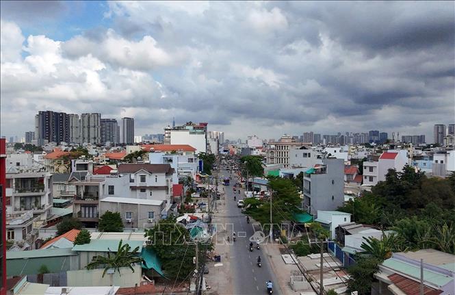 Đường Nguyễn Thị Định sẽ được mở rộng lên 30m, đáp ứng nhu cầu giao thông ngày càng tăng trong khu vực. Ảnh: Tiến Lực - TTXVN
