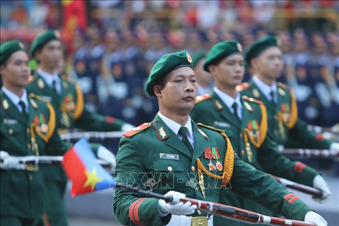 Soldiers parade at the final full-scale rehearsal to celebrate the 50th anniversary of the Liberation of the South and National Reunification Day. VNA Photo