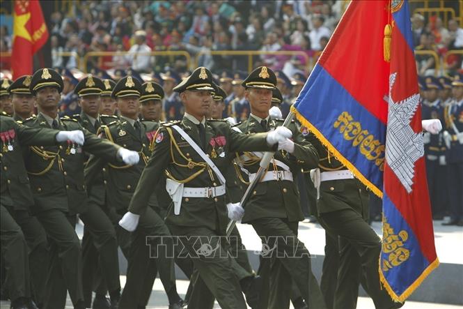 The Royal Cambodian Army marches through the grandstand. VNA Photo