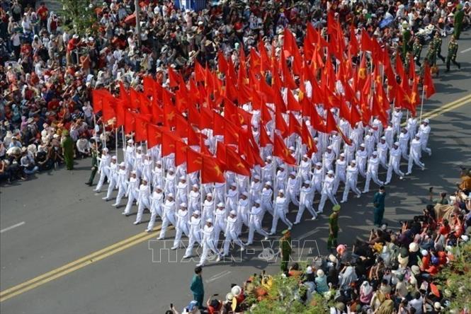 The procession of national flags and Party flags. VNA Photo