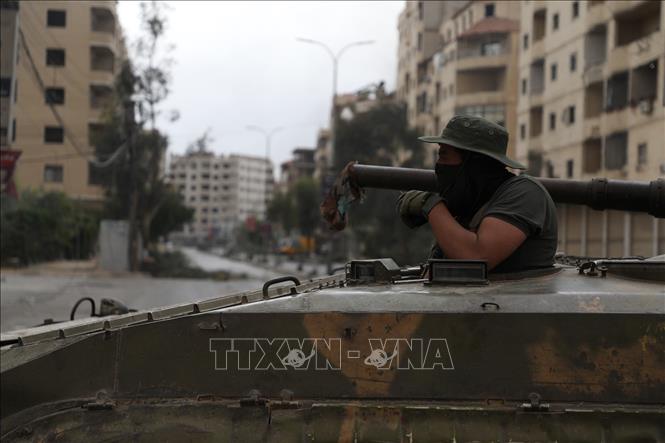 Lực lượng an ninh Syria gác tại thị trấn Ashrafiyat Sahnaya, Tây Nam thủ đô Damascus. Ảnh: THX/TTXVN