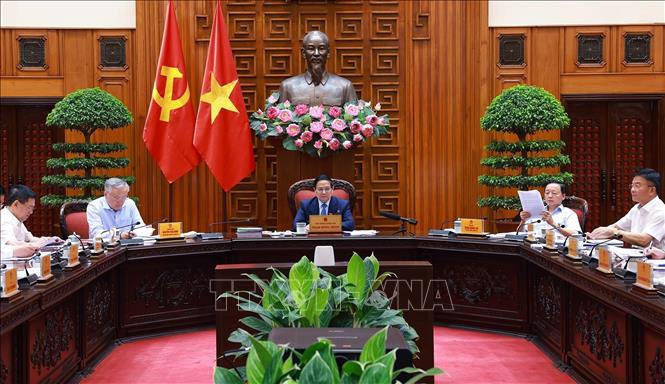 Thủ tướng Phạm Minh Chính chủ trì cuộc họp với các bộ, ngành để chuẩn bị đàm phán thương mại với Hoa Kỳ. Ảnh: Dương Giang-TTXVN
