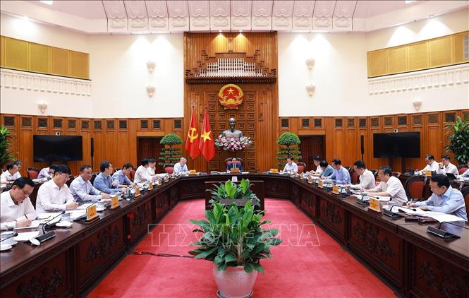 Thủ tướng Phạm Minh Chính chủ trì cuộc họp với các bộ, ngành để chuẩn bị đàm phán thương mại với Hoa Kỳ. Ảnh: Dương Giang-TTXVN
