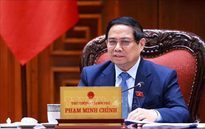 Thủ tướng Phạm Minh Chính chủ trì cuộc họp với các bộ, ngành để chuẩn bị đàm phán thương mại với Hoa Kỳ. Ảnh: Dương Giang-TTXVN
