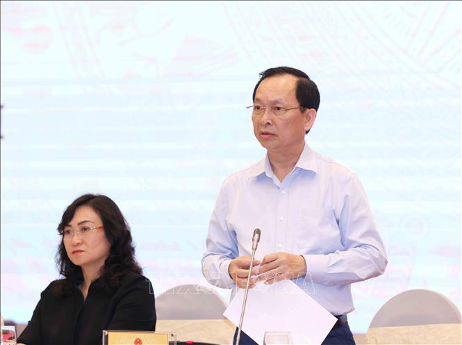 Phó Thống đốc Ngân hàng Nhà nước Đào Minh Tú trả lời câu hỏi của báo chí. Ảnh: Phương Hoa – TTXVN