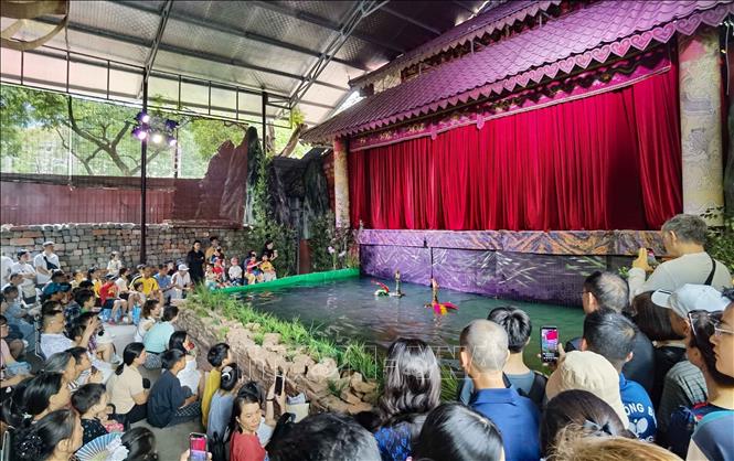 A water puppetry performance at the Thang Long Imperial Citadel. VNA Photo