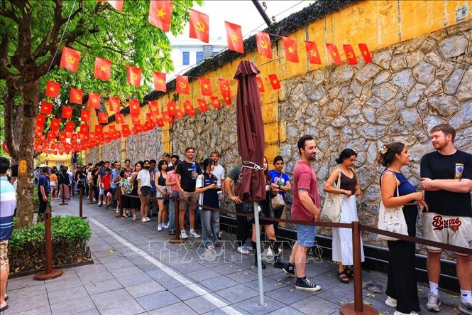 Tourists visit the Hoa Lo Prison relics site. VNA Photo