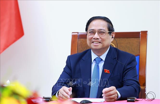 Thủ tướng Phạm Minh Chính điện đàm với Thủ tướng Singapore Lawrence Wong. Ảnh: Dương Giang-TTXVN 
