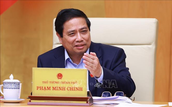 Thủ tướng Phạm Minh Chính chủ trì cuộc họp Chính phủ chuyên đề về việc sắp xếp, tổ chức lại đơn vị hành chính các cấp. Ảnh: Dương Giang-TTXVN
