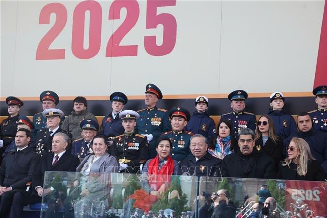 General Secretary of the Communist Party of Vietnam Central Committee To Lam and his spouse attend the military parade. VNA Photo: Thống Nhất