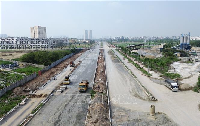 Các nhà thầu đang đẩy nhanh tiến độ dự án trước khi bước vào mùa mưa. Ảnh: Quốc Khánh - TTXVN