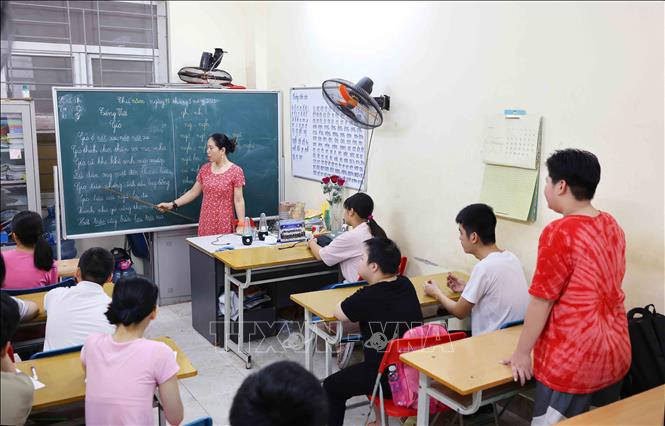 Để  học sinh thiểu năng biết đọc cần một thời gian khá dài. Ảnh: Phương Hoa - TTXVN