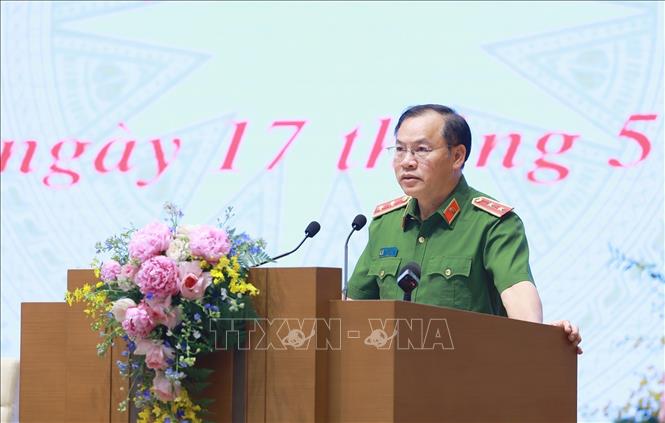 Trung tướng Nguyễn Văn Long, Thứ trưởng Bộ Công an báo cáo tình hình triển khai Đề án 06. Ảnh: Dương Giang-TTXVN 