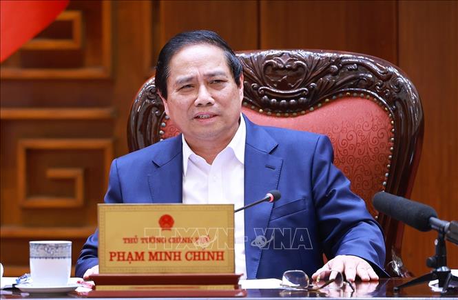 Thủ tướng Phạm Minh Chính chủ trì cuộc họp về dự thảo phát triển giáo dục, đào tạo và chăm sóc sức khoẻ nhân dân. Ảnh: Dương Giang-TTXVN 
