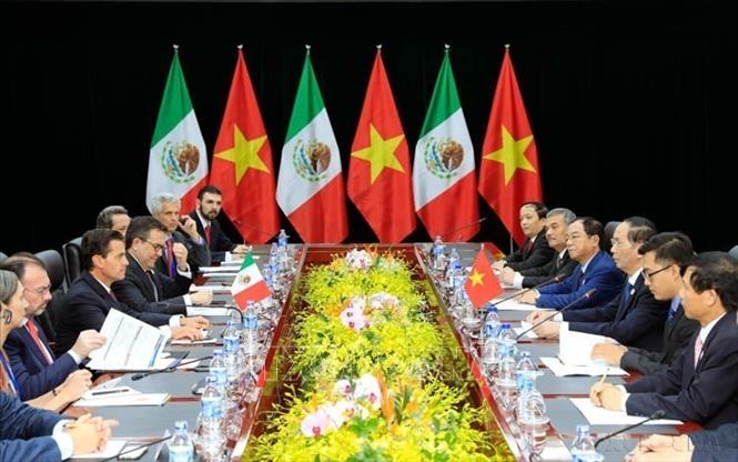 Trong khuôn khổ Tuần lễ Cấp cao APEC 2017, chiều 9/11/2017, tại Đà Nẵng, Chủ tịch nước Trần Đại Quang gặp song phương Tổng thống Mexico Enrique Peña Nieto. Ảnh: TTXVN