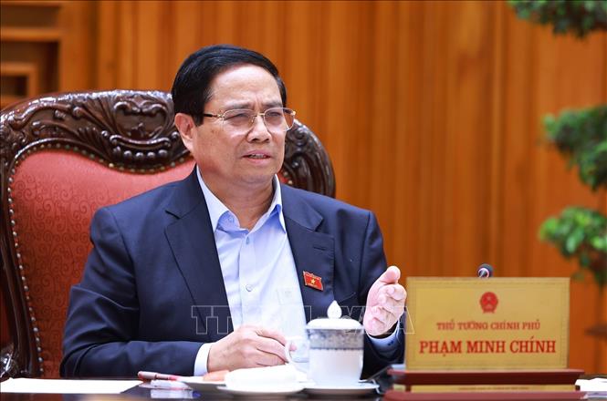 Thủ tướng Phạm Minh Chính chủ trì cuộc họp về tình hình triển khai tuyến đường sắt trọng điểm. Ảnh: Dương Giang-TTXVN
