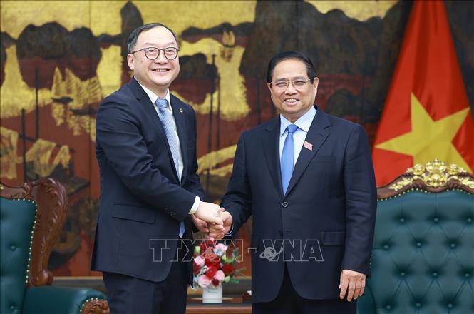 Thủ tướng Phạm Minh Chính tiếp ông Châu Gia Nghĩa (Zhou Jiayi), Chủ tịch Khu vực Châu Á – Thái Bình Dương của Tập đoàn Xây dựng Điện lực Trung Quốc. Ảnh: Dương Giang-TTXVN
