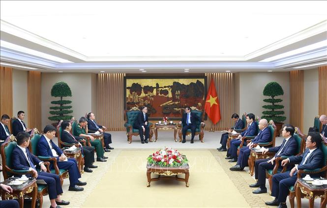 Thủ tướng Phạm Minh Chính tiếp ông Châu Gia Nghĩa (Zhou Jiayi), Chủ tịch Khu vực Châu Á – Thái Bình Dương của Tập đoàn Xây dựng Điện lực Trung Quốc và Chủ tịch, TGĐ các đối tác với Việt Nam. Ảnh: Dương Giang-TTXVN
