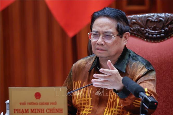 Thủ tướng Phạm Minh Chính chủ trì cuộc họp về Trung tâm tài chính quốc tế tại Việt Nam. Ảnh: Dương Giang-TTXVN
