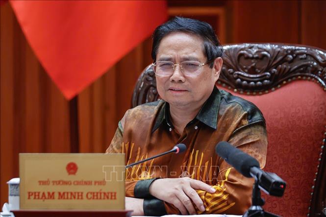 Thủ tướng Phạm Minh Chính chủ trì cuộc họp về Trung tâm tài chính quốc tế tại Việt Nam. Ảnh: Dương Giang-TTXVN
