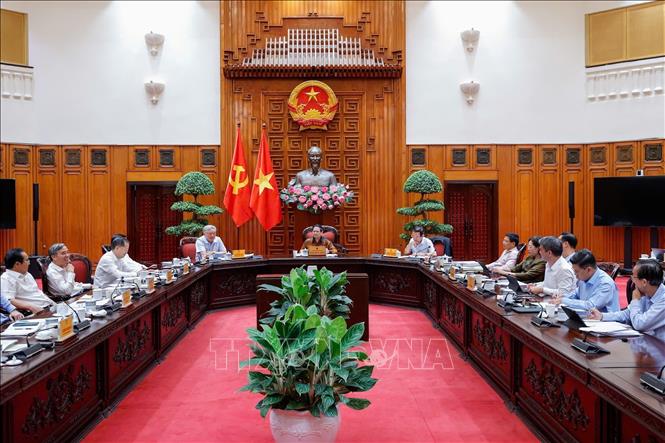 Thủ tướng Phạm Minh Chính chủ trì cuộc họp về Trung tâm tài chính quốc tế tại Việt Nam. Ảnh: Dương Giang-TTXVN
