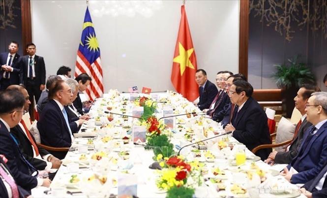 Nhân dịp sang dự Diễn đàn Tương lai ASEAN lần thứ hai tại Hà Nội, sáng 26/2/2025, Thủ tướng Phạm Minh Chính và Thủ tướng Malaysia Anwar Ibrahim ăn sáng và làm việc. Ảnh: Dương Giang-TTXVN