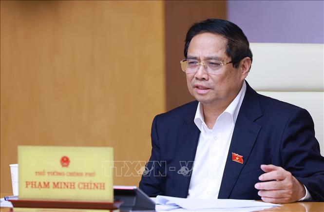 Thủ tướng Phạm Minh Chính chủ trì cuộc làm việc của Thường trực Chính phủ về tình hình thị trường bất động sản. Ảnh: Dương Giang-TTXVN
