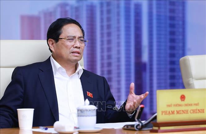 Thủ tướng Phạm Minh Chính chủ trì cuộc làm việc của Thường trực Chính phủ về tình hình thị trường bất động sản. Ảnh: Dương Giang-TTXVN
