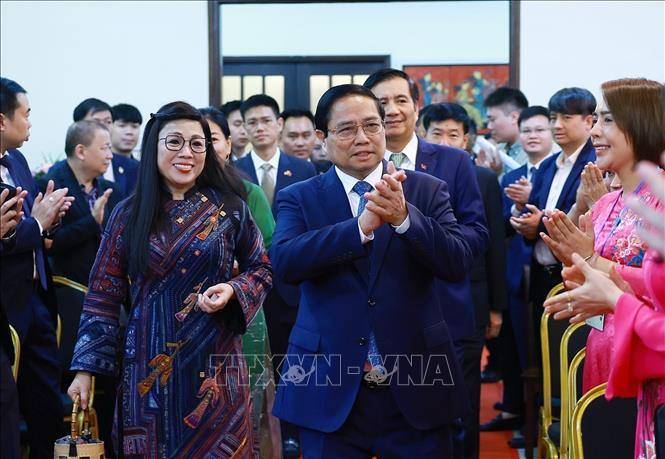 Prime Minister Pham Minh Chinh and his spouse at the meeting. VNA Photo: Dương Giang