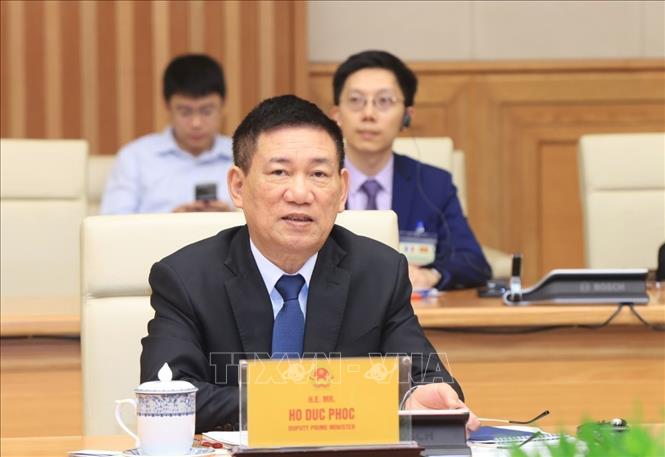 Deputy Prime Minister Ho Duc Phoc speaks at the meeting. VNA Photo: Tuấn Anh