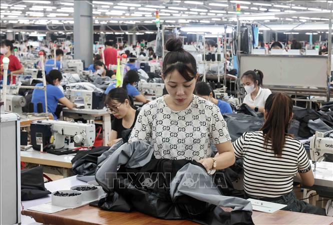Công ty may TNG Thái Nguyên mỗi năm đạt doanh thu hàng ngàn tỷ đồng, tạo việc làm cho hơn 20.000 lao động. Ảnh: Trần Việt - TTXVN