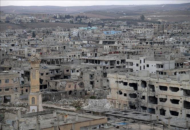 Những tòa nhà bị phá hủy do chiến sự tại Daraa, Syria. Ảnh: THX/TTXVN
