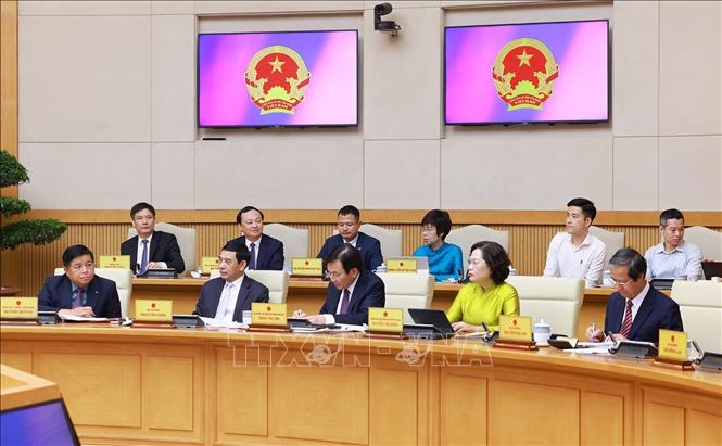 Các thành viên Chính phủ và đại biểu tham dự phiên họp. Ảnh: Dương Giang-TTXVN