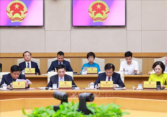 Các thành viên Chính phủ và đại biểu tham dự phiên họp. Ảnh: Dương Giang-TTXVN