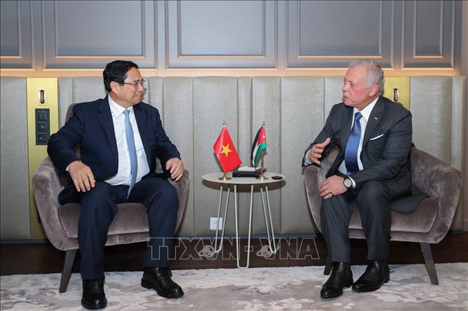 Thủ tướng Phạm Minh Chính gặp Quốc vương Jordan Abdullah II bin Al-Hussein. Ảnh: Dương Giang-TTXVN 
