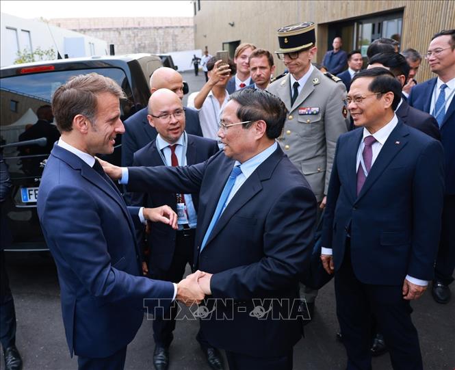 Thủ tướng Phạm Minh Chính hội kiến Tổng thống Pháp Emmanuel Macron. Ảnh: Dương Giang-TTXVN