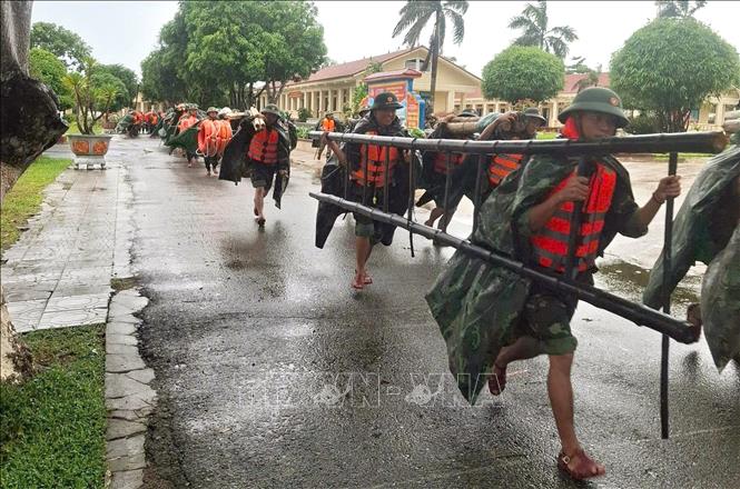 Military forces are mobilised to assist people to cope with the storm's aftermaths. VNA/Photo by courtesy