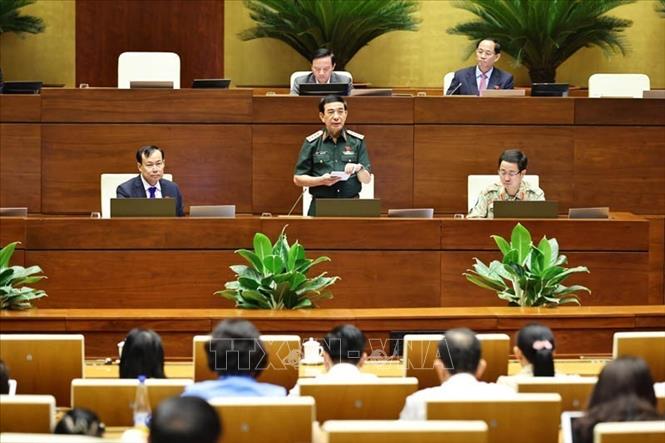 Đại tướng, Bộ trưởng Bộ Quốc phòng Phan Văn Giang phát biểu giải trình, làm rõ một số vấn đề đại biểu Quốc hội nêu. Ảnh: Minh Đức - TTXVN