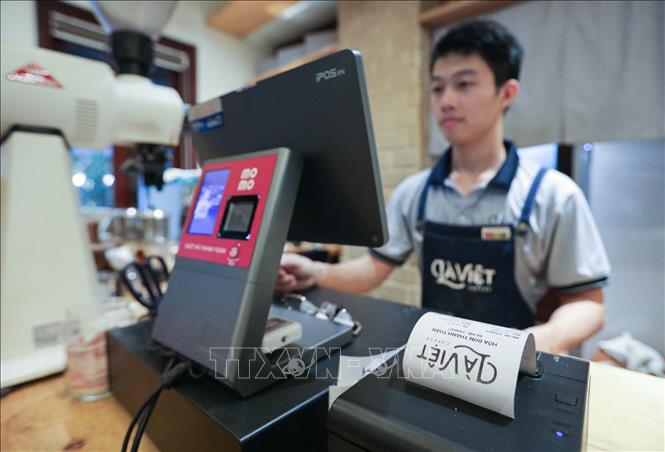 Công ty TNHH Cà phê Là Việt là một trong những đơn vị sớm triển khai hoá đơn điện tử khởi tạo từ máy tính tiền. Ảnh: Lê Đông - TTXVN