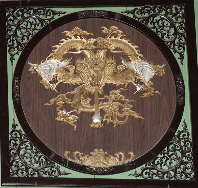 A wooden carving of a dragon, one of the four holy animals carvings that are displayed at the ancestral worship place. 